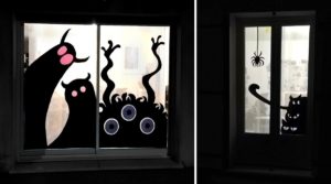 monstres d'halloween en papier collés sur les vitres